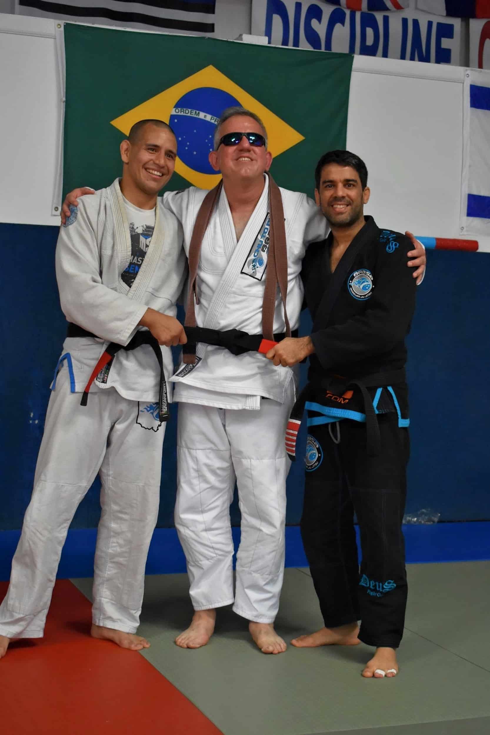 Lakeside Jiu Jitsu members in gi taking selfie in sunglasses.